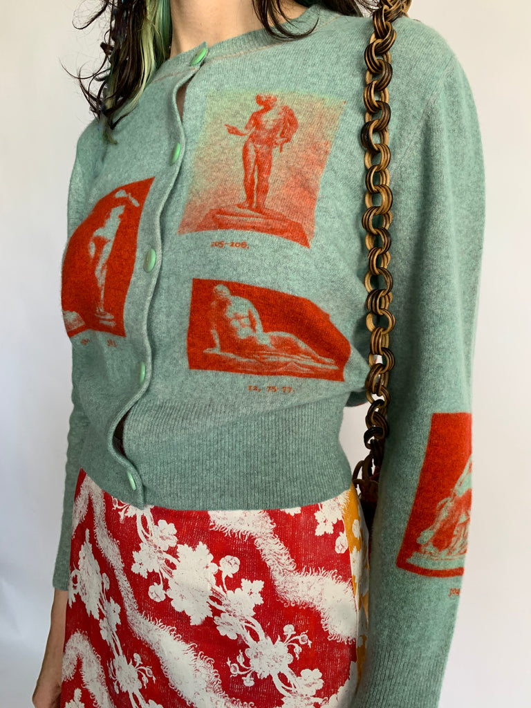 The Narcissus cardigan by UK brand HADES in turquoise and red 100% wool paul mescal gladiator