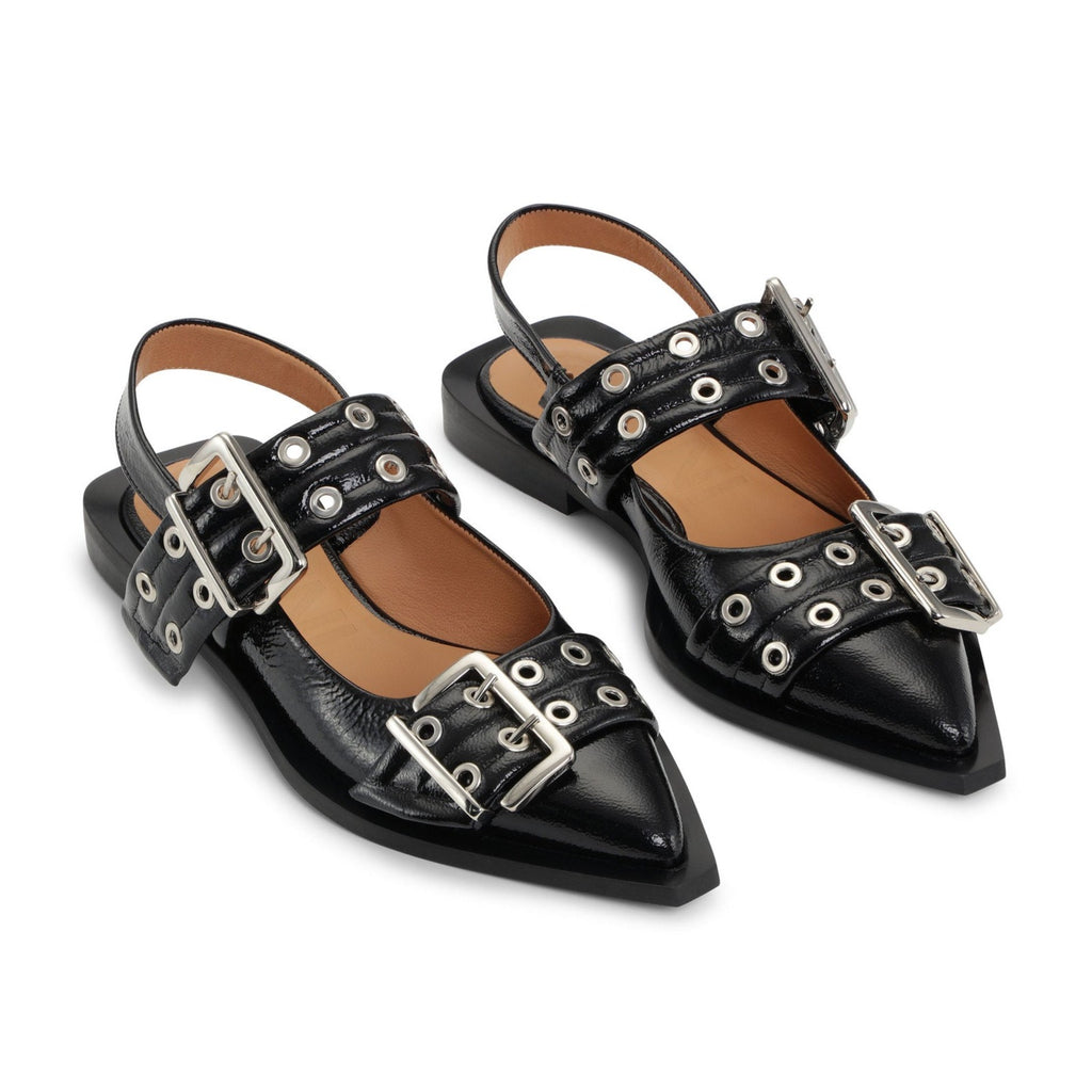chunky black slip on ballet flats with silver buckles and a sling back by Ganni