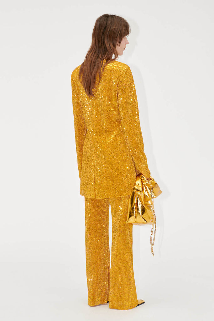 gold sequin trousers by stine goya