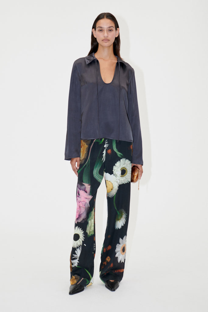 black pull on Fatou trousers with scanned flowers by Stine Goya