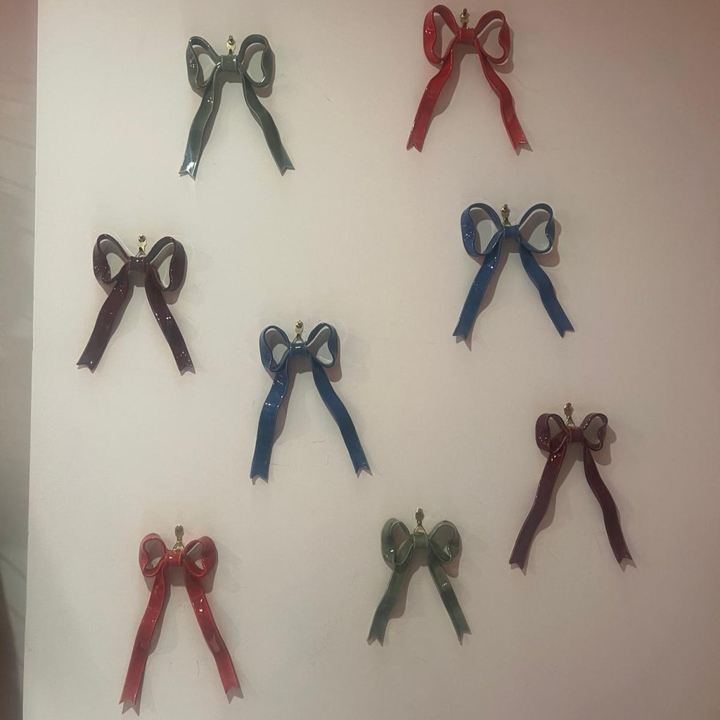 Hand-made ceramic bow wall decoration by Superfluities 