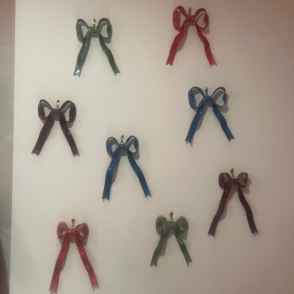 Hand-made ceramic bow wall decoration by Superfluities 