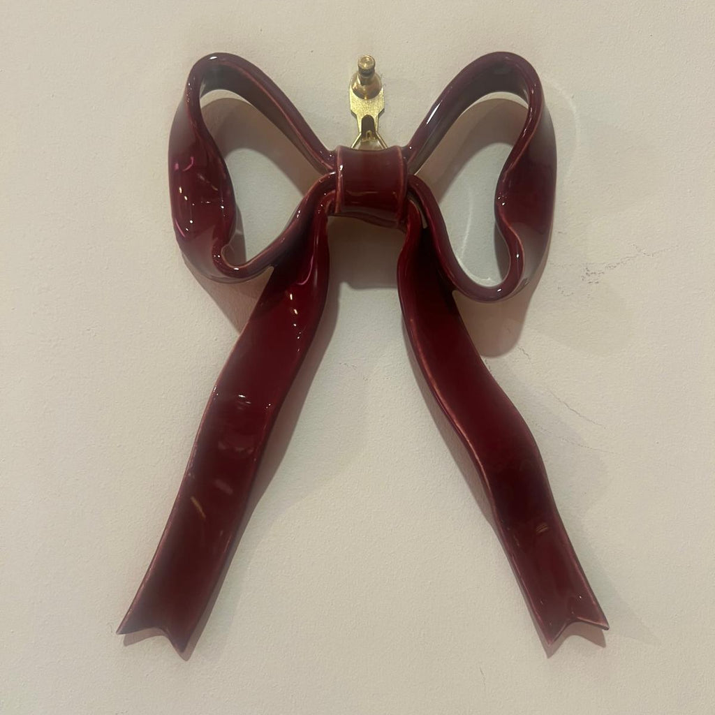 Hand-made ceramic bow wall decoration by Superfluities burgundy red