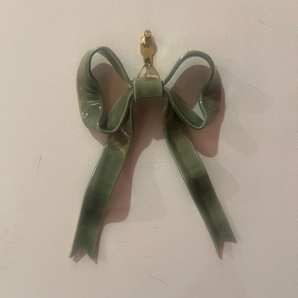 Hand-made ceramic bow wall decoration by Superfluities green