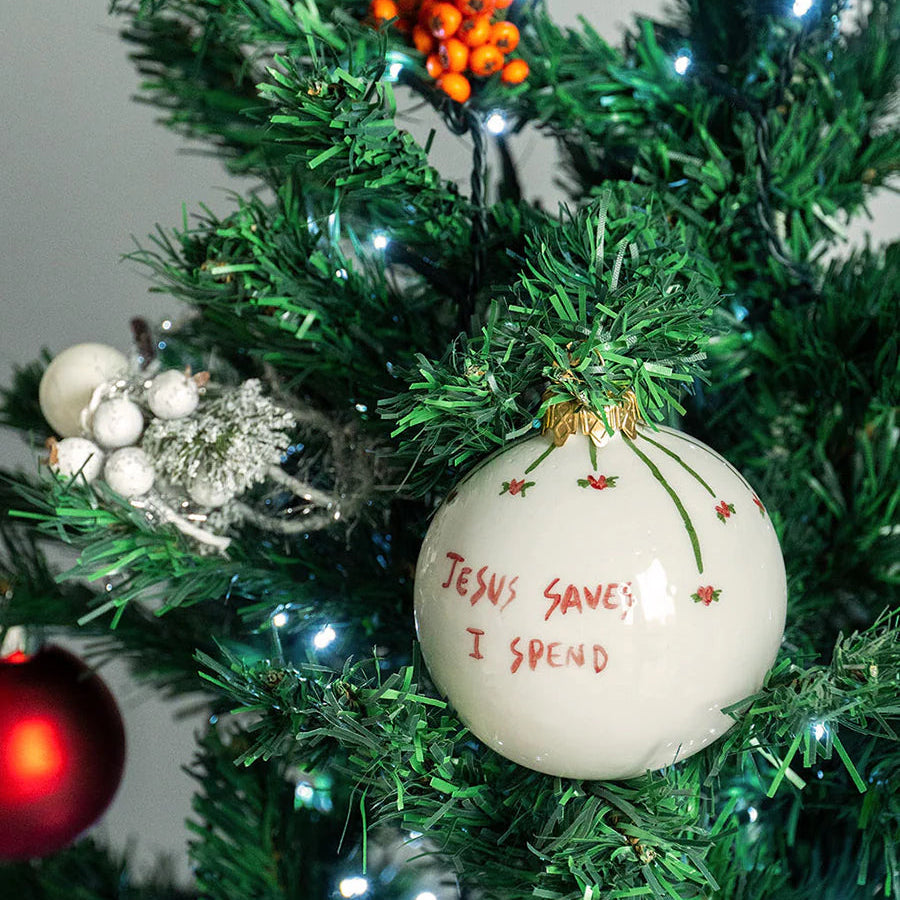 The Jesus Saves I Spend ceramic Christmas bauble by Musae Studio Italy