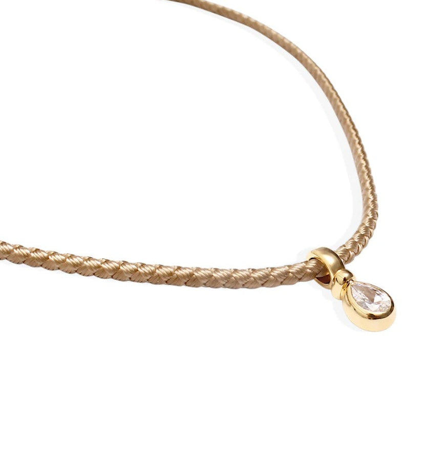By Alona Auralis necklace from TAUPE braided cord 18K gold teardrop pendant with a sparkling cubic zirconia stone