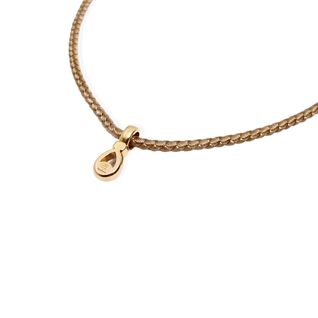 By Alona Auralis necklace from TAUPE braided cord 18K gold teardrop pendant with a sparkling cubic zirconia stone