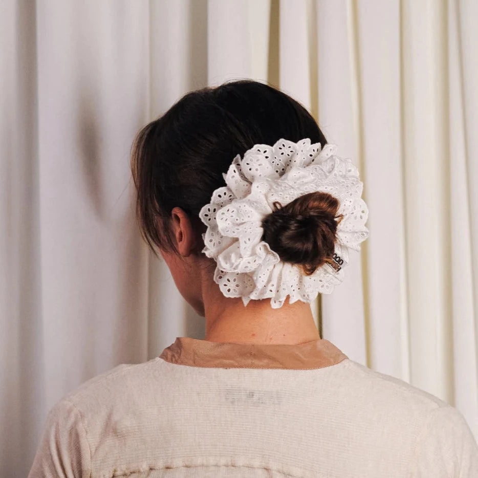 white cotton scrunchie with baby blumberg broderie anglais trim by good squish