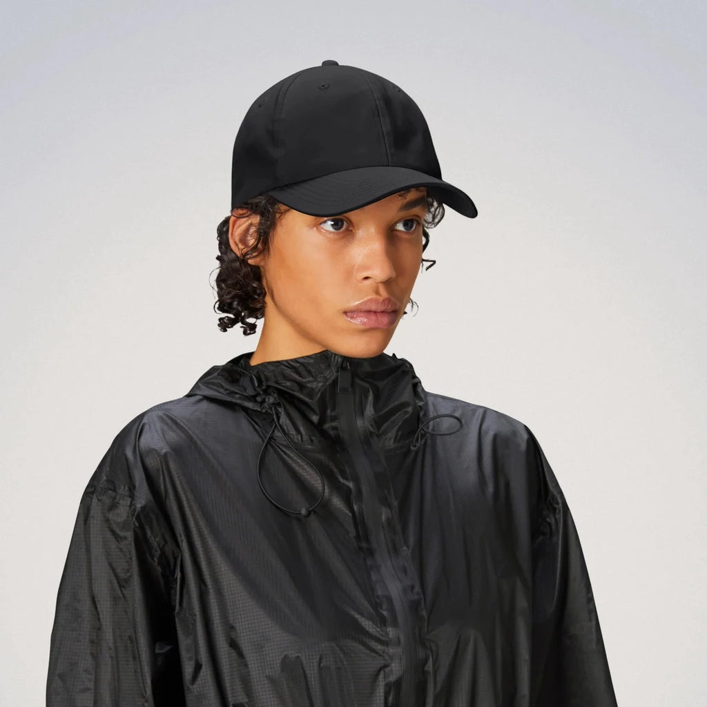 black waterproof cap by Rains