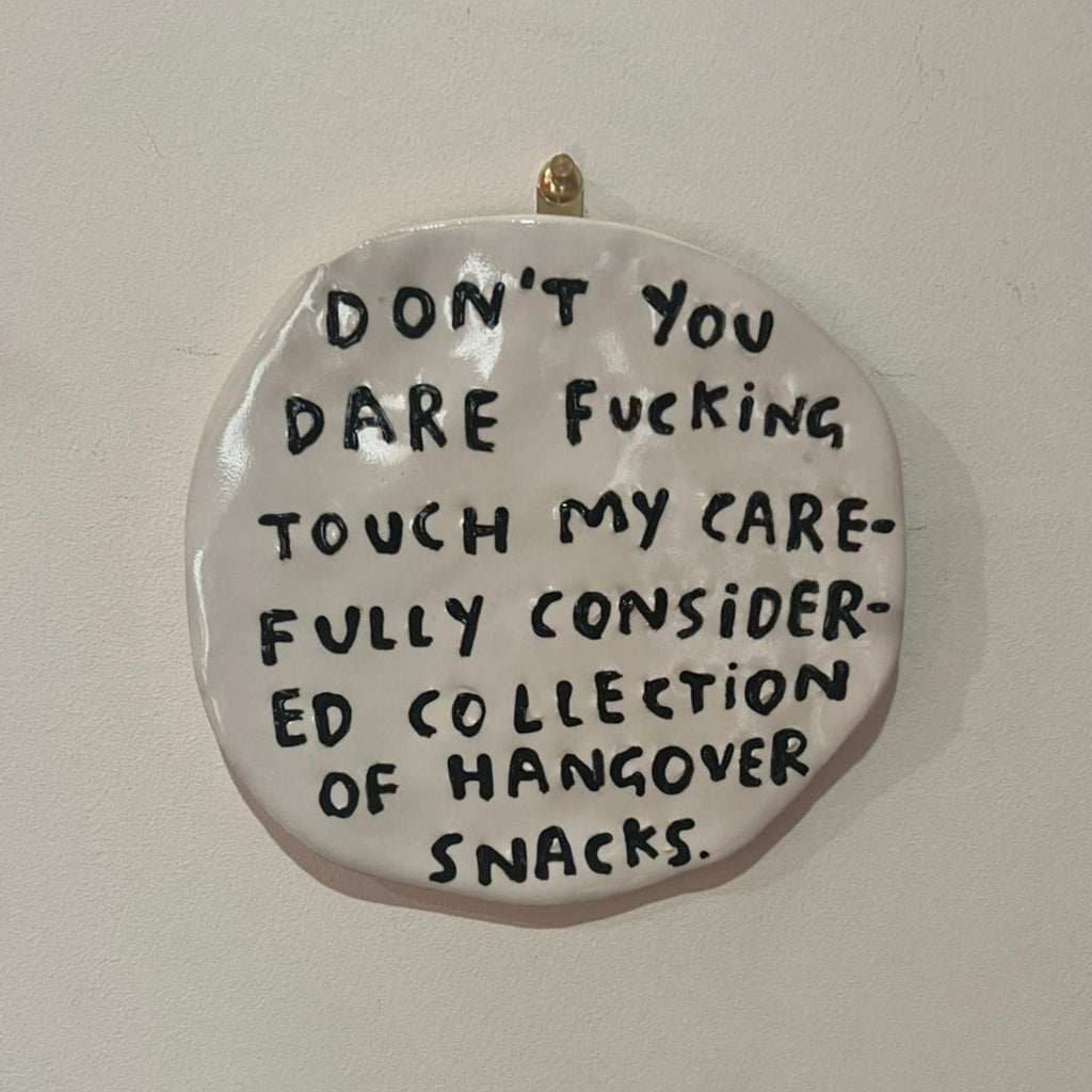 ceramic hate plate by dan jamieson saying don't you dare fucking touch my carefully considered collection of hangover snacks