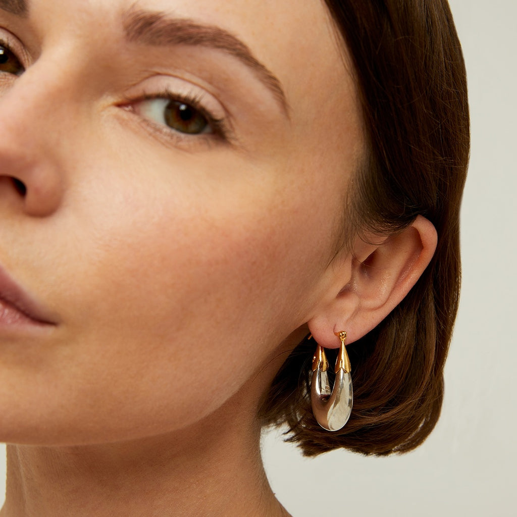 The small Ecume Bicolour earrings by Gas Bijoux in silver plating gold detailing