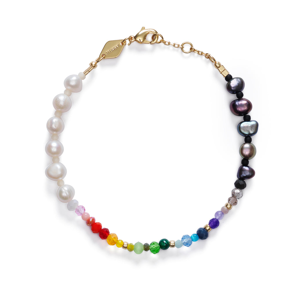 A bracelet by Anni Lu with a mixture of white and black pearls and multi-coloured semi-precious beads